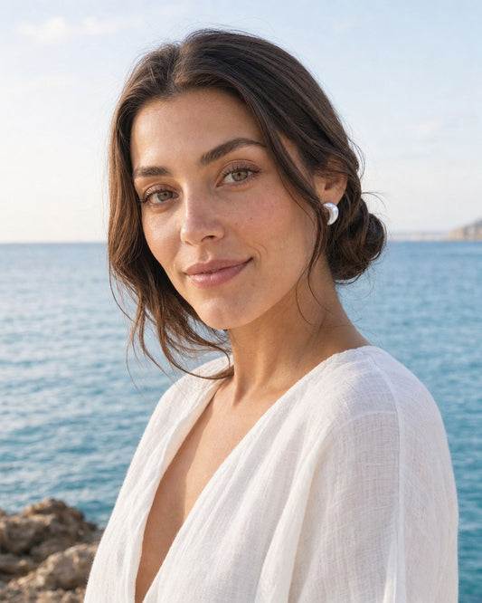 Crescent Moon Pearl Studs worn by the model