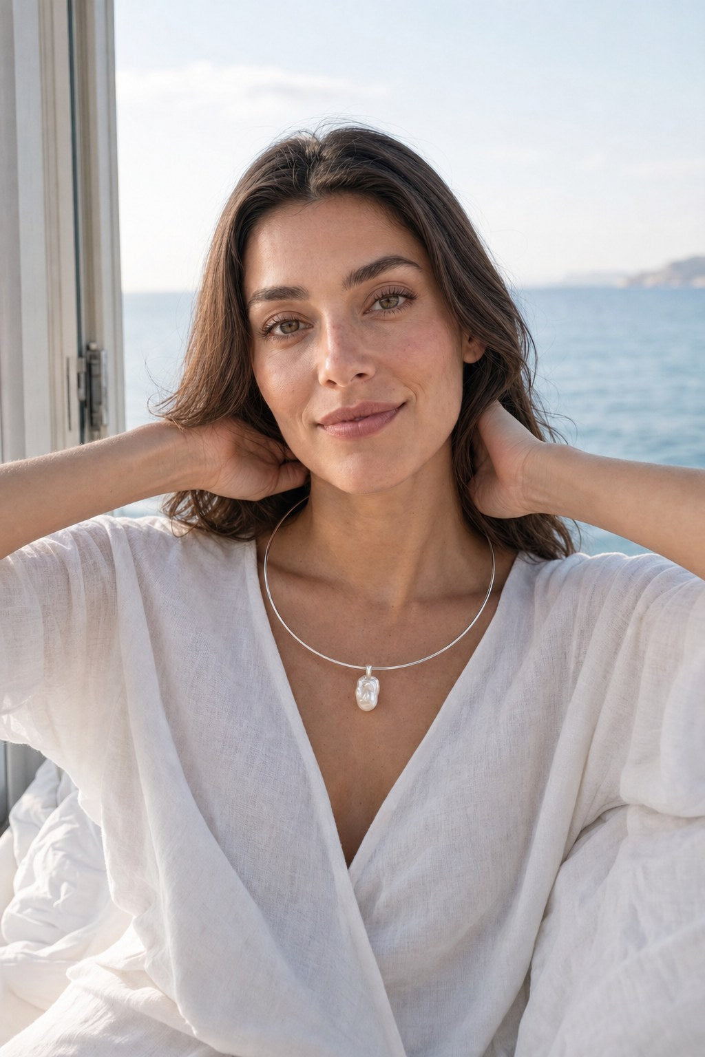 Silver Shore Pearl Collar on the model by the sea