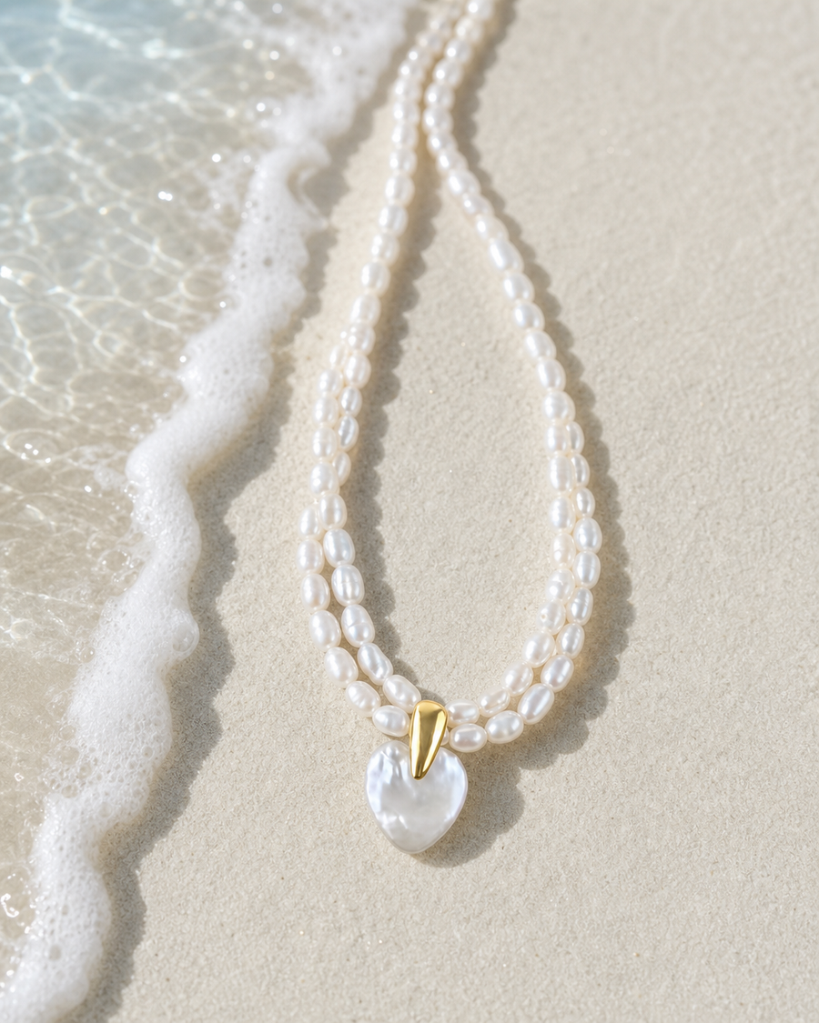 Pearl necklace on white sand