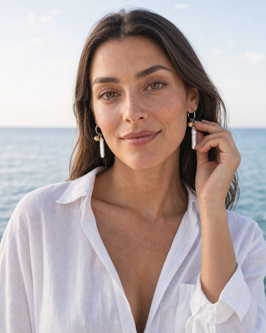 Sun & Sea Hoop Earrings worn by the model